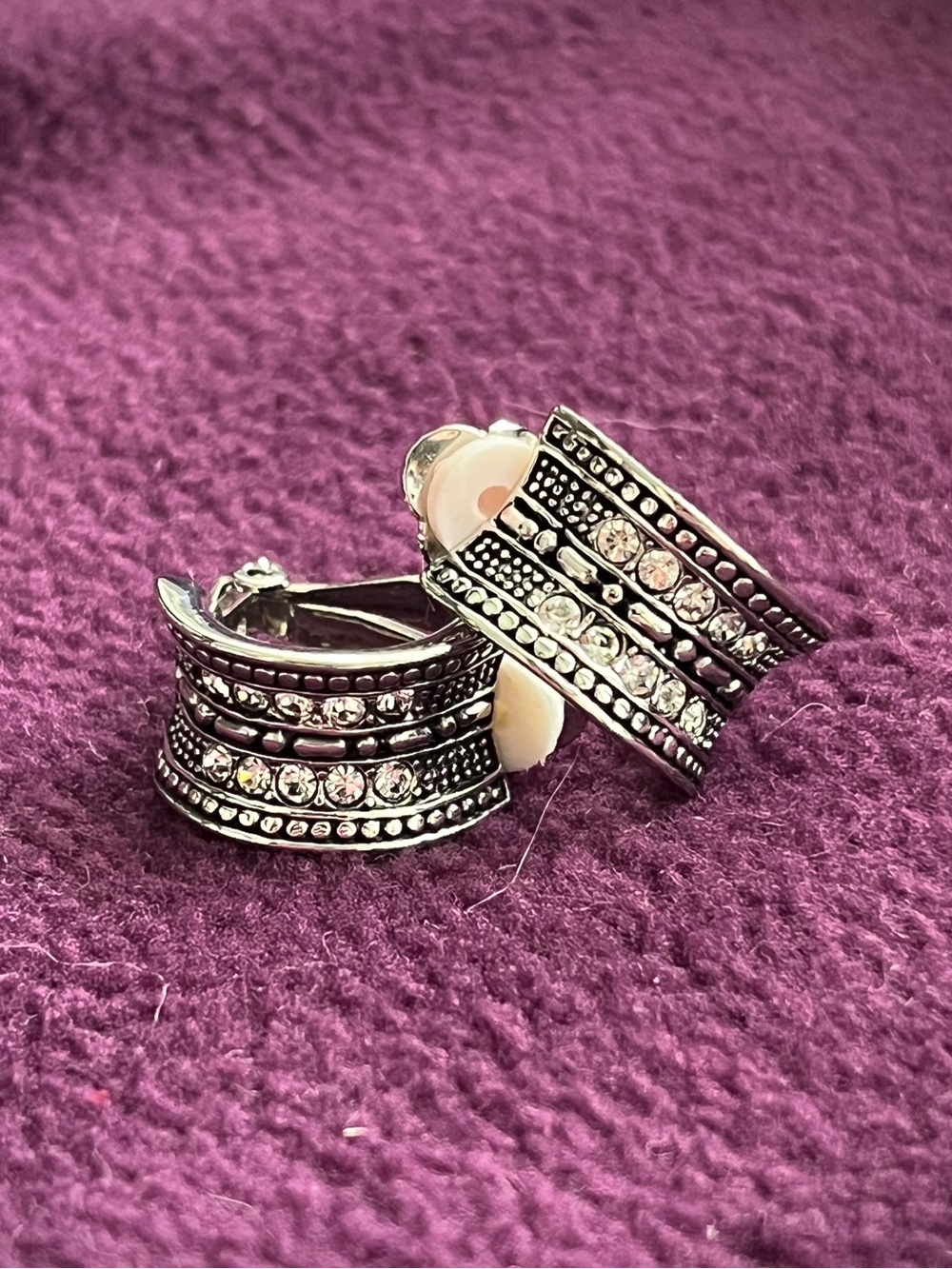 Silver-toned clip-on earring with clear crystals